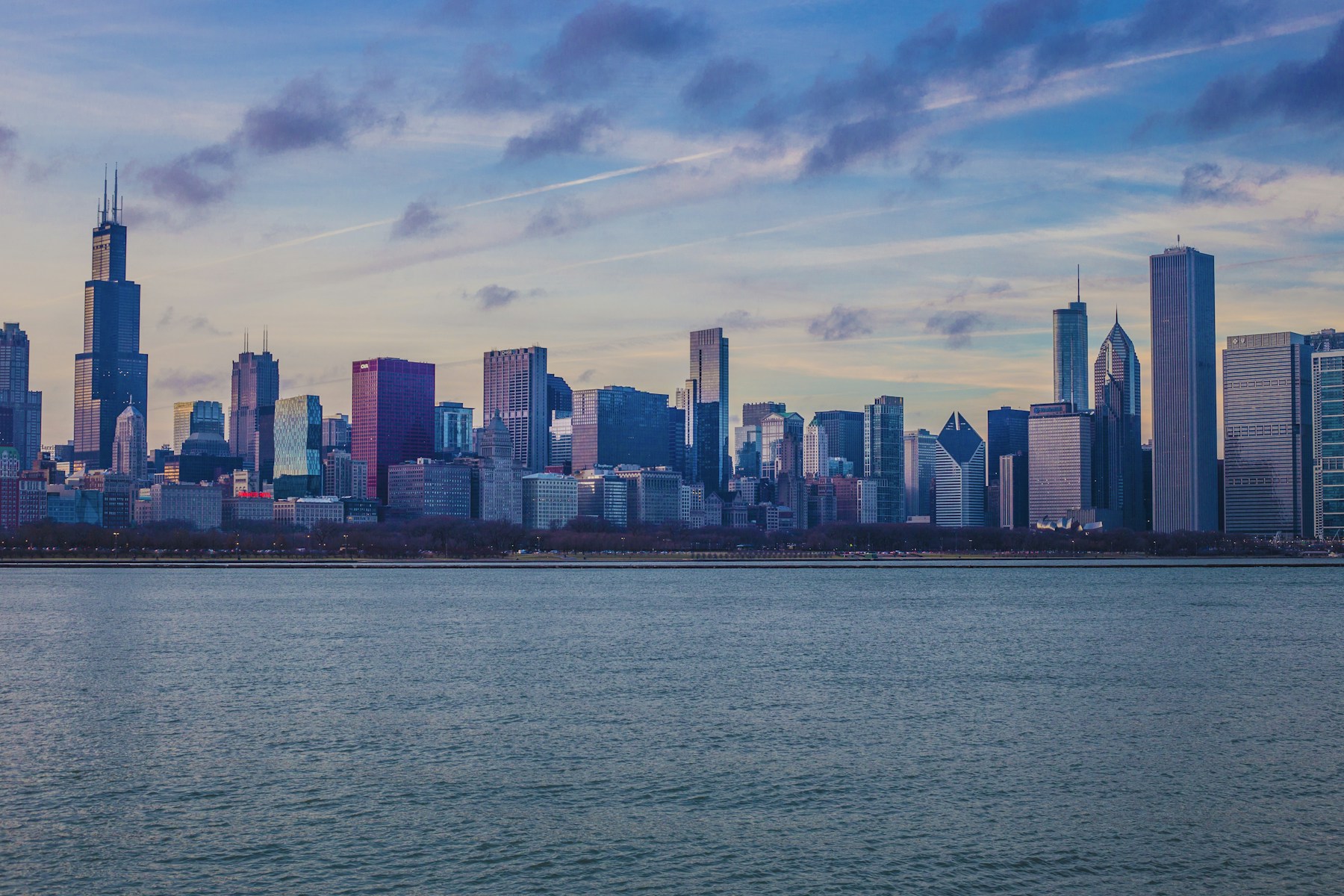 Chicago skyline across Lake Michigan at dusk